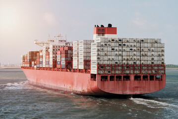 Antwerp, Belgium - 06 01 2023: Large container vessel with a tonnes of cargo on board underway to her next destination. Commercial shipping at full scale. Worldwide logistics. © I am from Mykolayiv