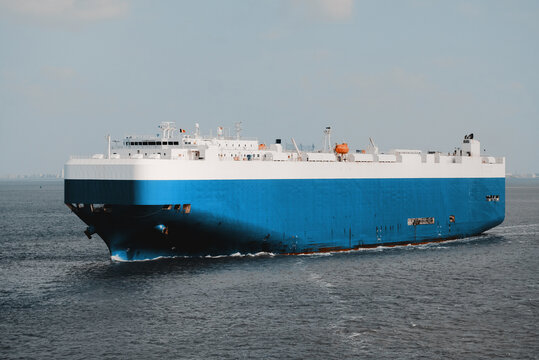Pure car carrier underway at sea. Fully loaded ro-ro vessel with the cargo of vehicles of different weight and size.