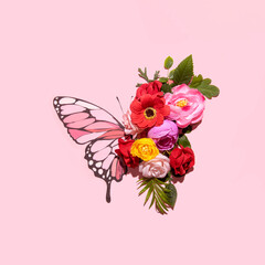 Floral butterfly, creative nature inspired arrangement, spring summer mood, pastel pink background. 