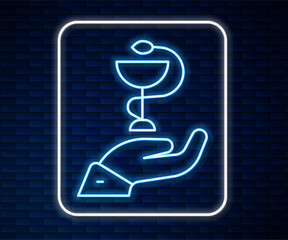 Glowing neon line Caduceus snake medical symbol icon isolated on brick wall background. Medicine and health care. Emblem for drugstore or medicine, pharmacy. Vector