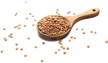 Pile green lentils in wooden spoon isolated on white, side view