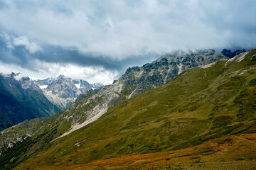 Mountain ranges on a sunny day at Georgia. Sky with clouds adn hills