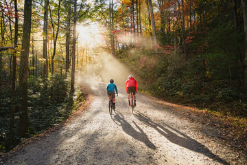 A couple gravel biking near Blue Ridge Parkway in autumn, Pisgah North Carolina