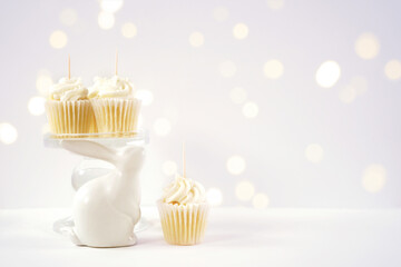 Cupcake topper product mockup. Minimal styling with bunny rabbit against a bokeh party lights background. Negative copy space.