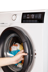 The hand select settings for laundry on modern digital display. Close-up view of automatic washing...