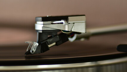 Fototapeta na wymiar Needle of a classic vinyl player detail
