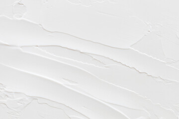 Swatch of white cream texture, cosmetics for face and body on a isolated light grey background....