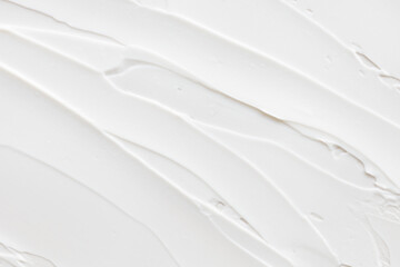 Swatch of white cream texture, cosmetics for face and body on a isolated light grey background....