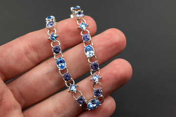 Dainty blue crystal bracelet, unique vintage jewelry background, rhinestone jewelry concept, promotional photo for an online jewellery store