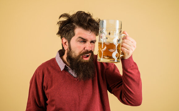 Oktoberfest festival. Bearded man drinking craft draught beer. Drunk bearded man with mug of beer. Alcohol, brewery. Bad habits. Alcoholism. Beer degustation. Man with beard tasting fresh brewed beer.