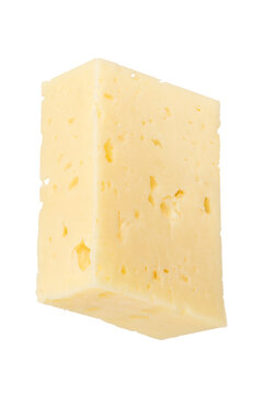 Big piece of cheese isolated on white background. Cheese for pizza. A piece of cheese cut into rectangle on a white background, close-up. Insert into a design or project.