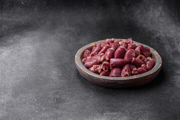 Raw chicken or turkey hearts with salt, spices and herbs