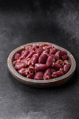 Raw chicken or turkey hearts with salt, spices and herbs