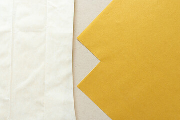 cut paper and parchment paper bag on beige