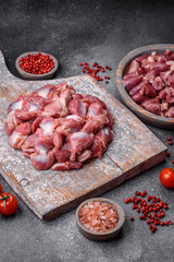 Raw chicken or turkey gizzards with salt, spices and herbs