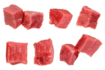 Pieces of raw beef. Set of fresh beef cubes isolated on white background. Isolate of beef cubes to insert into a design, project or for an advertising banner.