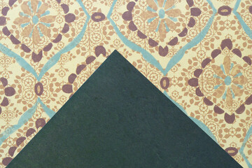 pyramidal shape on decorative scrapbooking paper with damask like pattern
