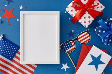 Obraz premium Idea for a Fourth of July celebration party. Top view flat lay of gift boxes, postcard, national flag, american glasses and stars confetti on blue background with blank frame for text or ads