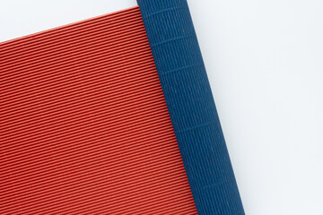 blue and red corrugated crafting cardboard sheets on white
