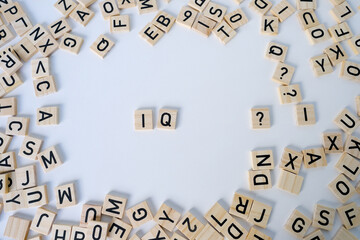 word IQ, wooden letters on wooden table, intelligence quotient on wooden background, quantitative...