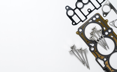 Spare parts for car engine repair on a white background. Top view, copy space