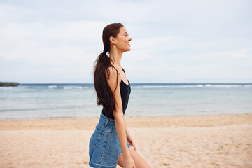 Fototapeta na wymiar young woman smile running vacation lifestyle sea beach sunset travel summer