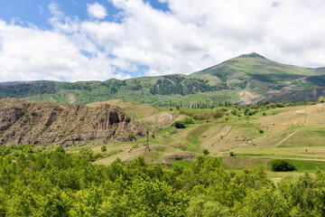 Lesser Caucasus mountains landscape in Samtskhe Javakheti region in Georgia with lush forests and meadows.