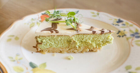 a piece of cake on a plate, on the restaurant table