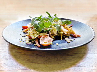plate of salad on a table in a cafe