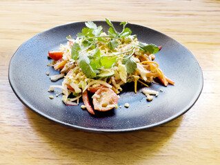 plate of salad on a table in a cafe