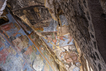 Church of Dormition with colorful medieval frescos in Vardzia cave monastery complex, Georgia....