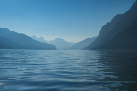 Beautiful view of Lake Walensee (Lake Walen or Lake Walenstadt) in canton St. Gallen and Glarus with a mountain range in the background. Switzerland, Europe