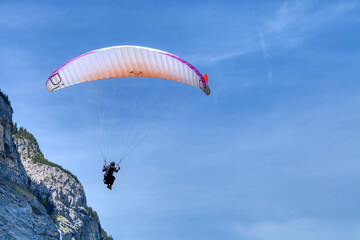 Paragliding parachuting is an extreme sport and recreation. Paragliding at the landing