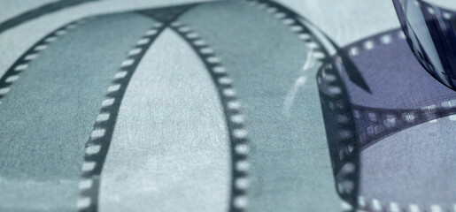 background with film strip.abstract background with shadows from film strip on gray surface for banner background