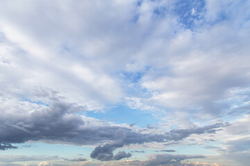 Blue light sky with many white cirrus and fluffy clouds background texture, heaven