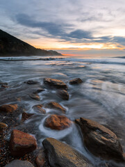 Flowing water through rock in the coastline of Coalcliff Beach, Sydney, Australia.