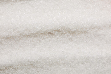 Granulated white sugar as background, top view