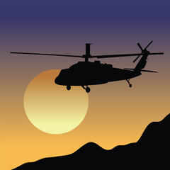 Fototapeta na wymiar military helicopter with sunset background
