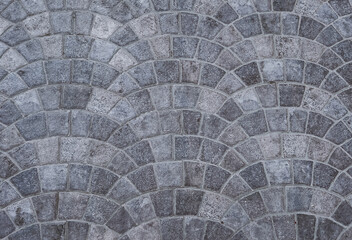 Gray floor tiles in a circular pattern