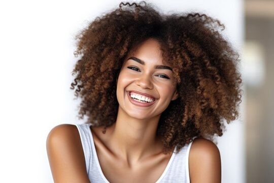 Smiling confident stylish young woman standing on white background. Young laughing curly-haired lady  looking at camera  generative AI