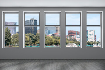Panoramic picturesque city view of Boston at day time from modern empty room, Massachusetts. An intellectual, technological and political center. 3d rendering.