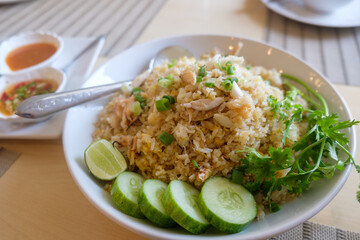 Savory Delight: Crab Fried Rice with Side Sauce and Fresh Vegetables