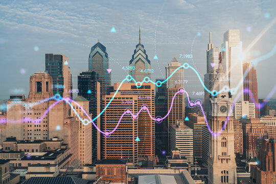 Aerial panoramic cityscape of Philadelphia financial downtown, Pennsylvania, USA. City Hall Clock Tower, sunrise. Forex candlesticks and bar graph hologram. The concept of internet trading, brokerage