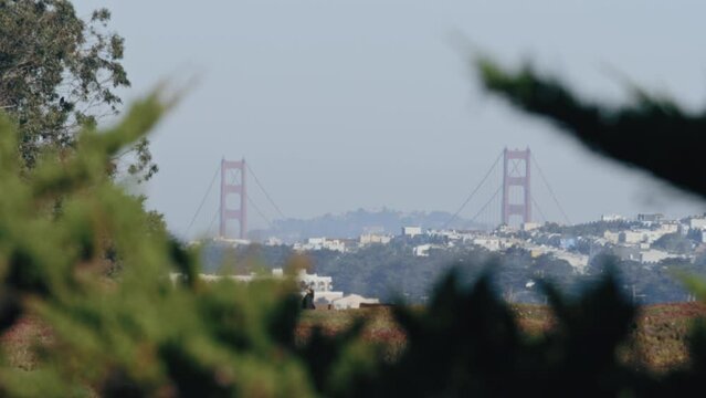 Telephoto view of Golden Gate Bridge tower and suspension cables from Daly City