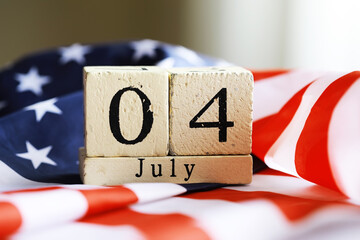 July 4th wooden Stars and Stripes flag on background with flag of the USA. Summer day. Independence...