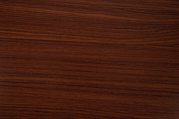 Reddish brown wood grain background.