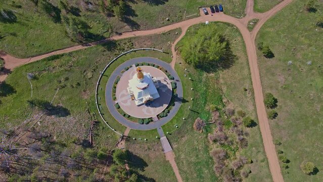 Experience the serene majesty of the Great Stupa of Dharmakaya from a mesmerizing bird's eye perspective