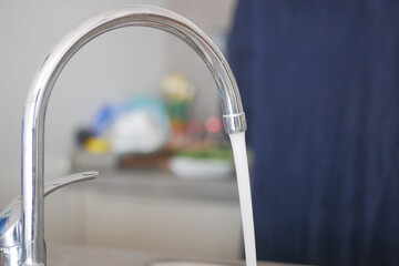 water pouring from a faucet tap slow motion 