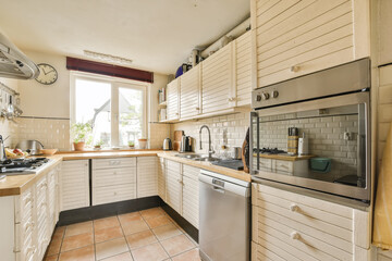 a kitchen that is clean and ready to be used as a home appliance in the house or apartment