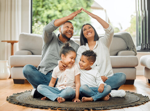 Family, parents and children with roof, safety and protection with love, care and security with happiness at home. Hands together, insurance cover or people in house with mom, dad and kids with trust